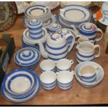 A collection of T.G. Green electric blue CornishwareOne milk jug with chips to base and another is