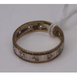 A 9ct yellow and white gold and CZ set eternity ring, 2.5g (one stone missing), size Q