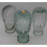 Three Art Deco style moulded glass milliners hat stands, each h.30cm
