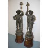 A pair of 19th century spelter figures, each mounted upon a wooden plinth, h.102cm