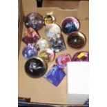 A collection of glass paperweights