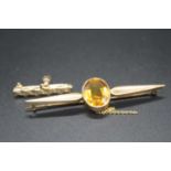 A 9ct gold and citrine set bar brooch, the oval cut citrine measuring approx 15 x 11mm, 5.5g,