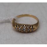 A vintage ladies yellow metal diamond half hoop ring, set with five graduated old cuts, 2.9g,