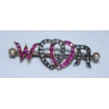 A Victorian yellow and white metal, ruby and diamond sweetheart brooch, with the letters W and R and