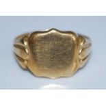 An 18ct yellow gold shield shaped signet ring, head dimensions approx 12.8 x 12mm, size P½, gross