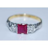 A yellow and white metal, synthetic ruby and diamond three stone ring, the centre square cut ruby