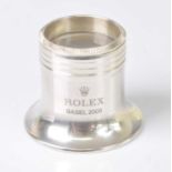 A Rolex Basle 2005 white metal watchmaker's eye glass, in fitted Rolex box, gross weight 45.8g,