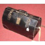 A mid-20th century black leather doctor's case, having brass combination lock and partially fitted