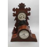 A late 19th century American walnut cased mantel clock, having a painted wooden dial with eight-