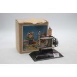 A Little Betty child's sewing machine, boxedNo rust.Several areas of paint losses, mostly to