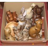 A box of miscellaneous items, to include a pair of resin figures of rabbits, pair of carved wooden