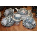 A Wedgwood six-place setting tea service, the turquoise frieze decorated with mythical figures,