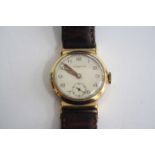 A vintage Tiffany & Co 9ct gold cased manual wind wristwatch, having a signed silvered Arabic dial