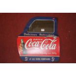 A reproduction Coca-Cola advertising wall mirror, in the form of a car door, 50 x 41cm