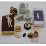 A collection of various minature ceramic dolls to include a early 20th century continental bisque