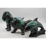 A large Blue Mountain hollow moulded pottery model of a lion in roaring pose, width 41cm, together