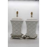 A pair of modern ceramic table lamps, each of waisted rectangular form with lattice type