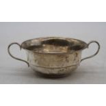 A George V silver twin handled bowl, dia.11cm, 3.2oz