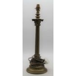 A brass table lamp having a Corinthian capital on a fluted column and domed base, height 51cm