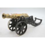 A miniature brass and iron cannon, 48cm