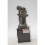 A bronze figure of a Spinario, surmounted upon a black polished hardstone plinth, h.20cm