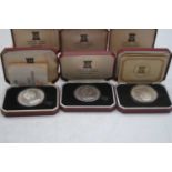 A collection of Isle of Man six silver crowns, cased