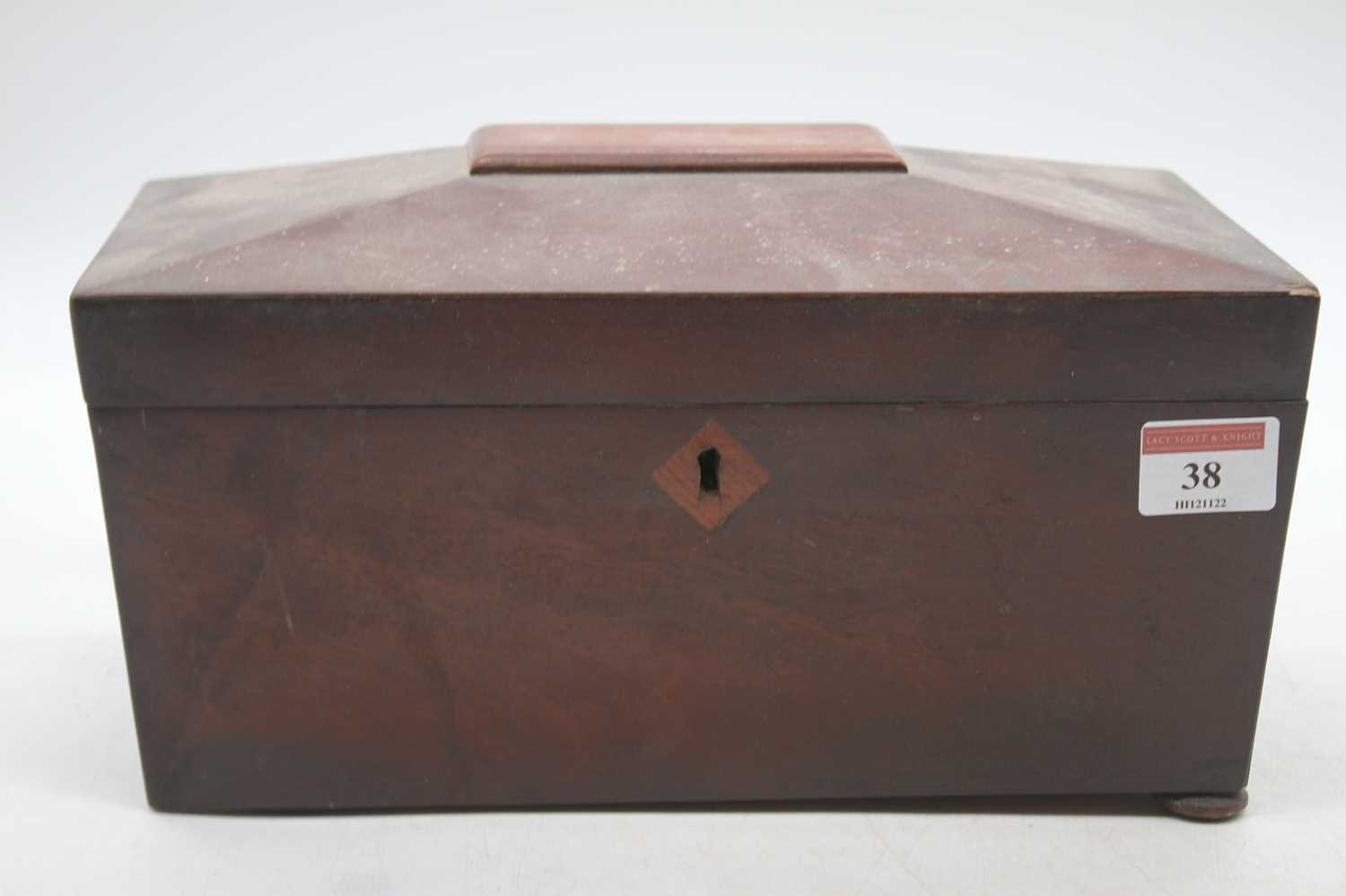 An early Victorian mahogany tea caddy of sarcophagus form on bun feet, width 27cm