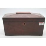 An early Victorian mahogany tea caddy of sarcophagus form on bun feet, width 27cm