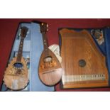 An Italian mandolin, cased; together with one other; and a zither