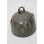 An Eastern bronze bell, of dome form, h.9.5cm