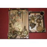 Two boxes of miscellaneous metalware, to include a pair of Victorian turned brass candlesticks,