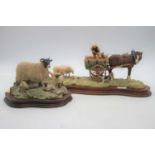 A Border Fine Arts resin figure, modelled as a horse drawn cart with farmer feeding sheep on