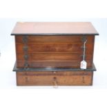 A Victorian walnut and ebonised table top chest of four long drawers with drop handles, width