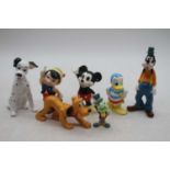 A collection of Japanese Disney China character figures, to include Mickey Mouse, the largest h.13cm