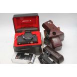 A Leica R4 SLR camera body, serial #1609572, with Leica SF 20 flash, R4 motor winder and grip,
