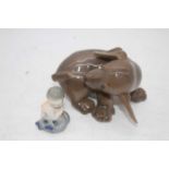 A Royal Copenhagen model of a puppy, h.7cm; together with one other of a mermaid, h.5cm (2)