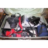 A collection of photography equipment to include a Pentax MX SLR camera, and a Canonet 28 SLR