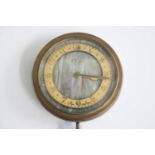 A pre-war eight-day car clock, in steel case with brass bezel and faux mother of pearl dial, keyless