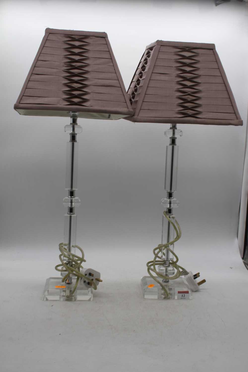 A pair of Laura Ashley table lamps, each having a facet cut perspex column on further facet cut