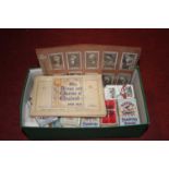 A collection of vintage cigarette cards, mainly Players and Tenner