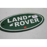 A reproduction cast iron Landrover advertising wall plaque, 17x35cm