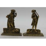 A pair of brass figures, each in standing pose, the gentleman with a bow in hand, on naturalistic