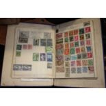 A vintage stamp album and contents