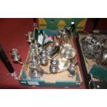 A collection of silver plated wares, to include a pair of three-branch table candelabra, teapot,