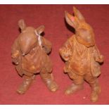 A pair of contemporary rusted cast iron garden figures, each in the form of a Beatrix Potter