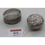 A Victorian silver pocket snuff / pill box, of circular tapered form, the hinged lid repousse