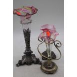 A Victorian cranberry tinted glass trumpet vase, mounted upon a white metal stand, h.30cm;