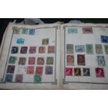 A collection of vintage stamp albums and contents