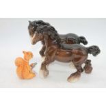 A Beswick model of a cantering Shire, model No.975, brown gloss, h.22cm; together with one other