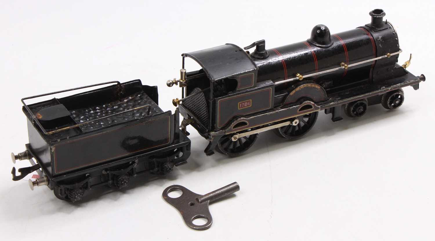 Bing 0 gauge 4-4-0 clockwork loco & coal-rail tender, black with red lining. Areas of repainting - Image 2 of 3